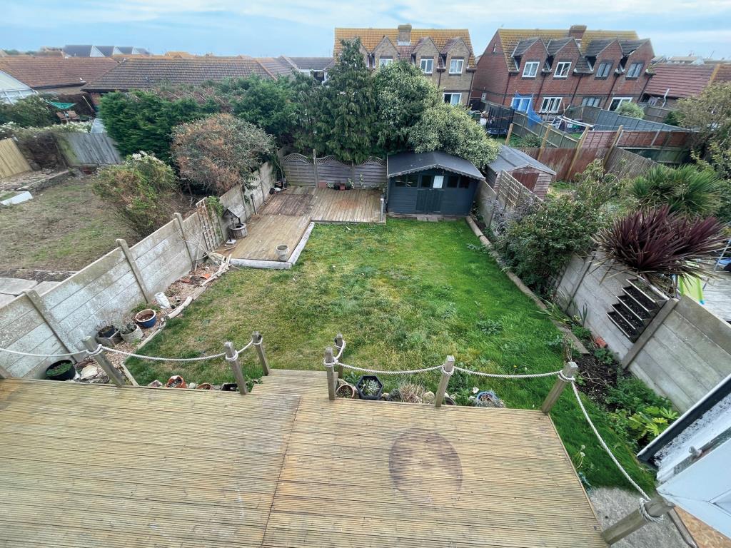 Lot: 28 - LINK-DETACHED THREE-BEDROOM HOUSE FOR REDECORATION - Garden taken from first floor window